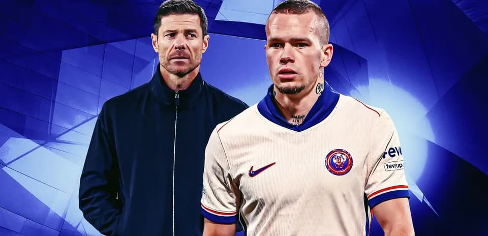 Coach and player in team kit against blue background