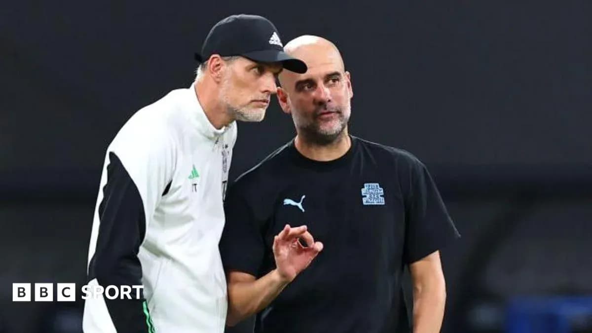 Two football managers discussing strategy on the sidelines