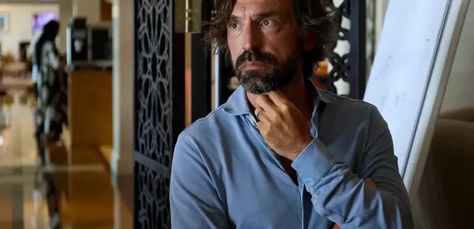 Man in blue shirt thinking in hotel lobby