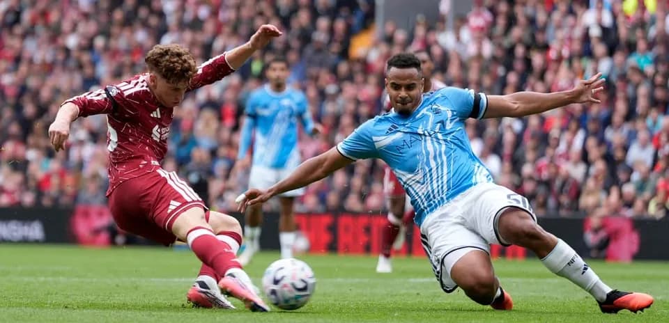 Player tackling opponent during football match