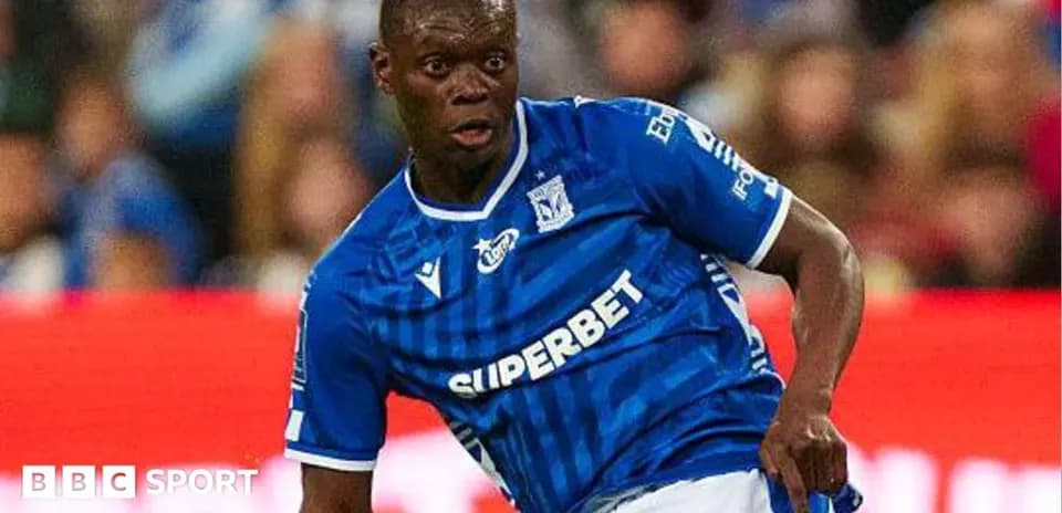 Player in blue jersey dribbling the ball