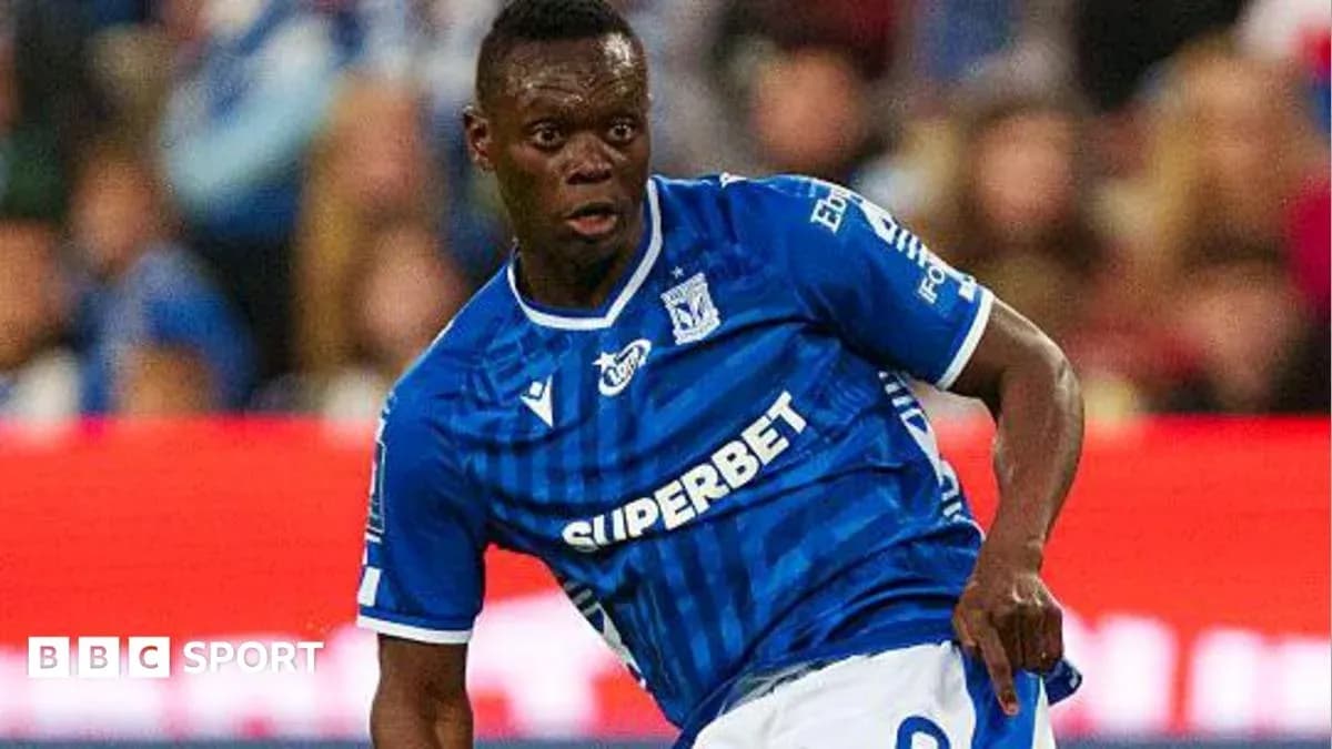 Player in blue jersey dribbling the ball