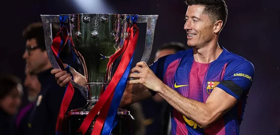 Player holding trophy during victory celebration