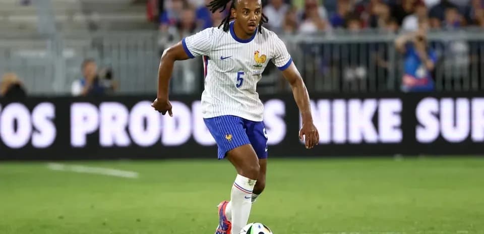 Player dribbling a soccer ball during match