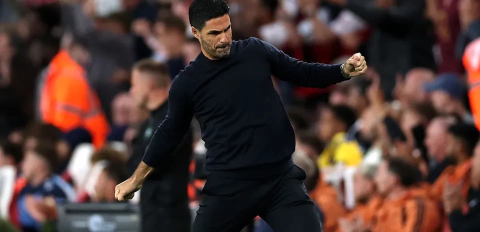Manager celebrating during a match with fans