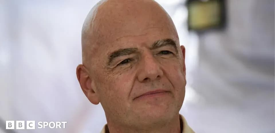 Man with bald head and neutral expression