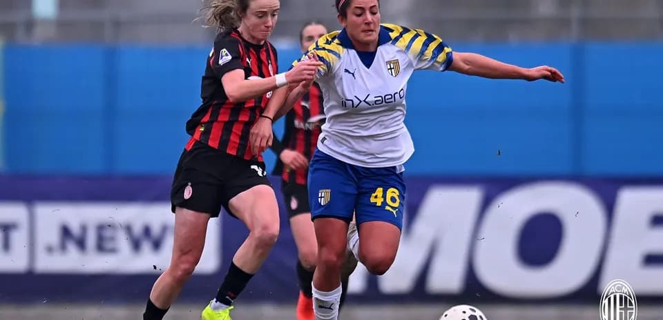 AC Milan and Parma players competing for the ball