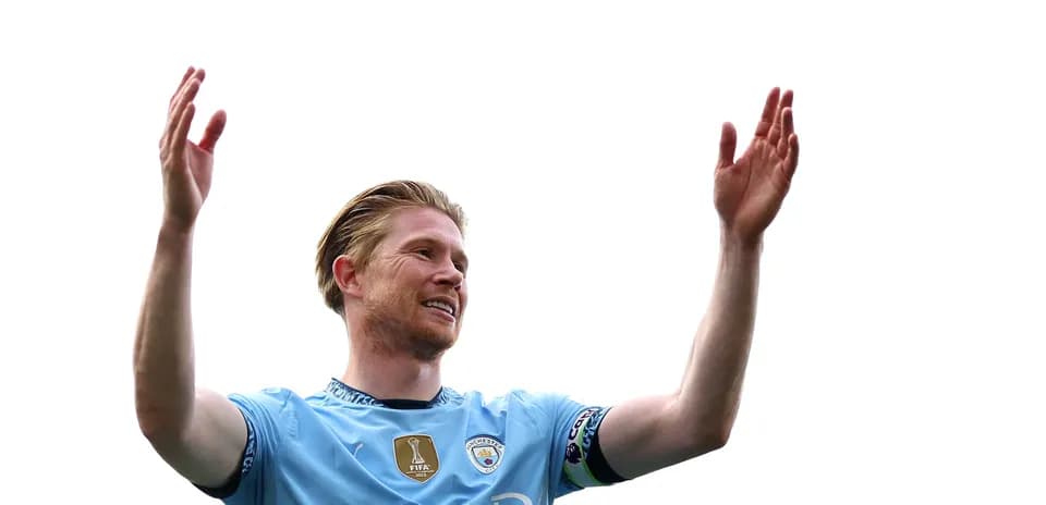 Player celebrating with arms raised on pitch