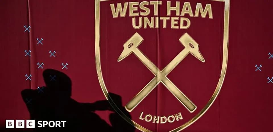 West Ham United logo on a maroon background