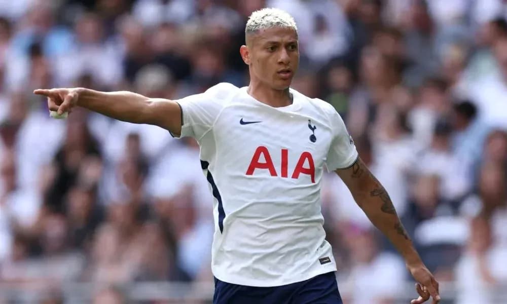 Player pointing during match wearing Tottenham kit