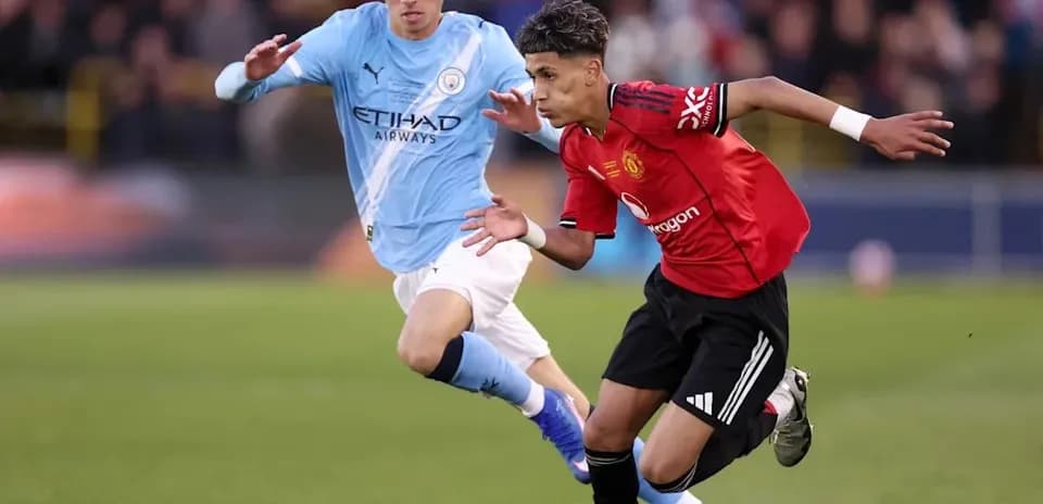 Two players competing for the ball during match