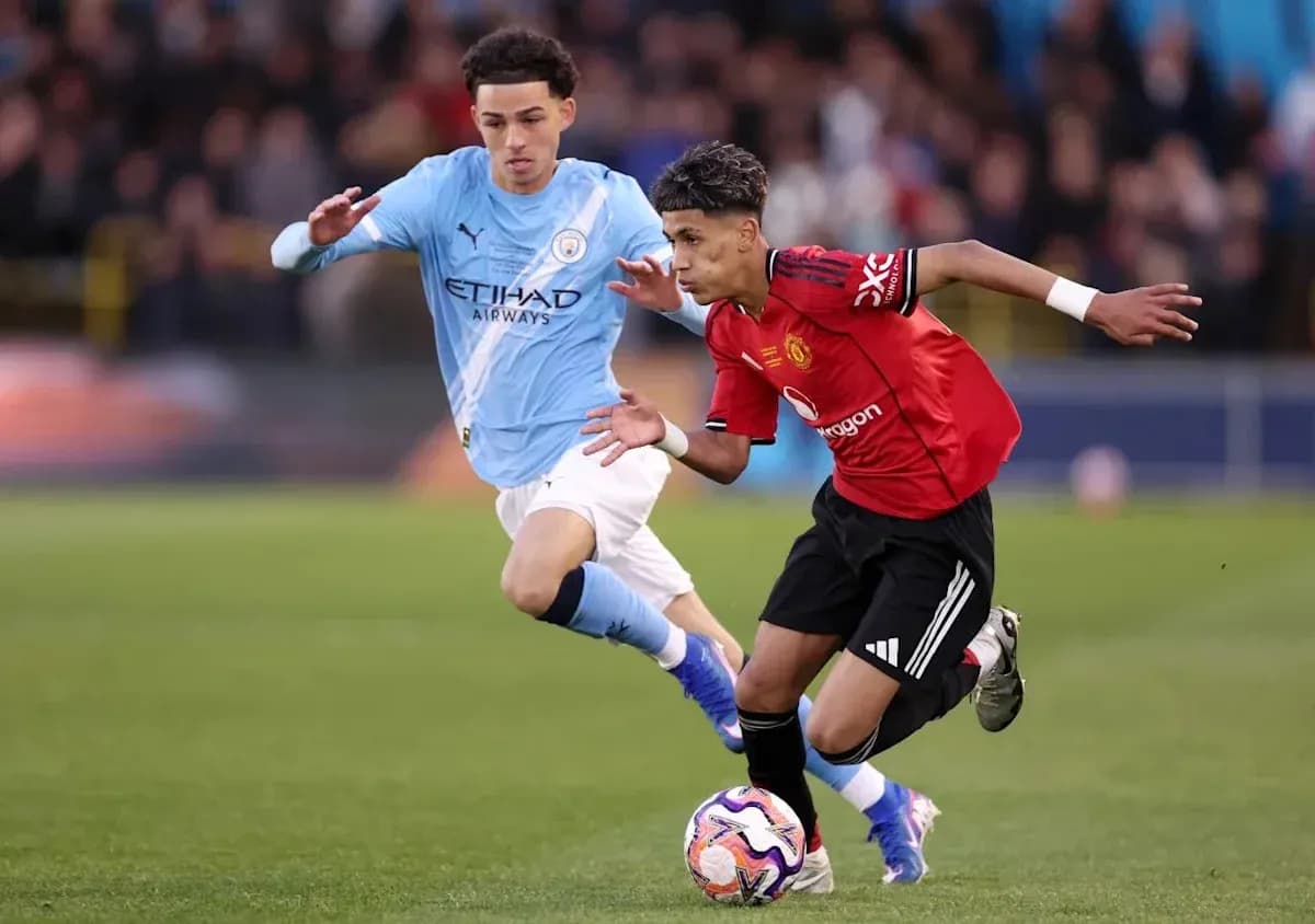 Two players competing for the ball during match