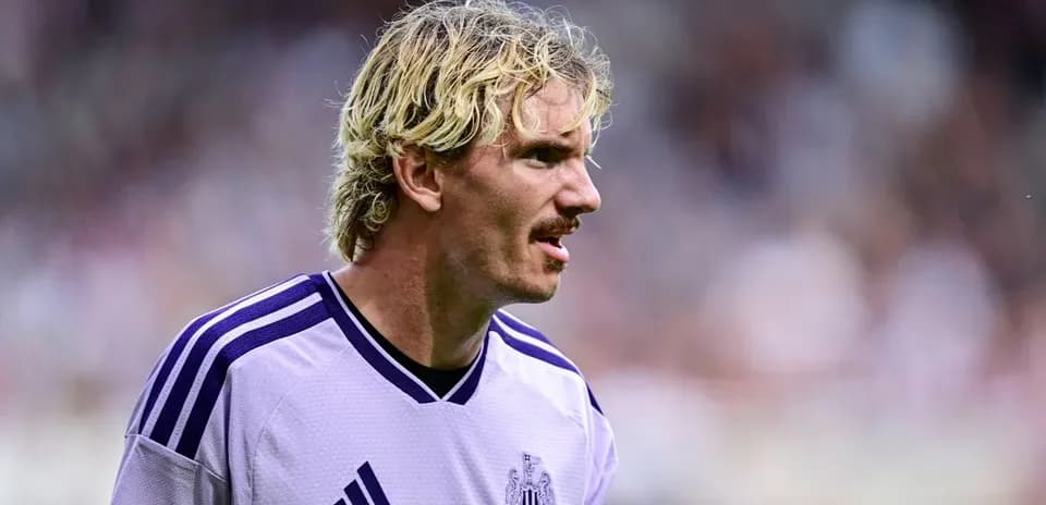 Newcastle player in purple jersey during match