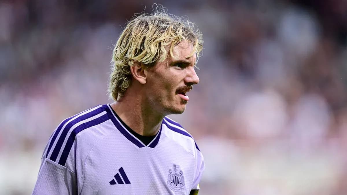 Newcastle player in purple jersey during match