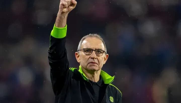 Manager raising fist in celebration during match