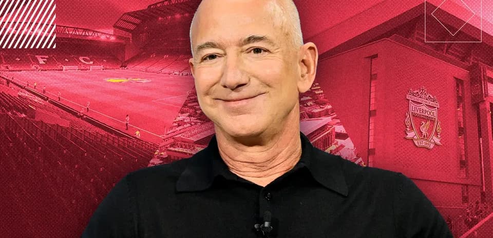 Person smiling in front of Liverpool FC stadium backdrop