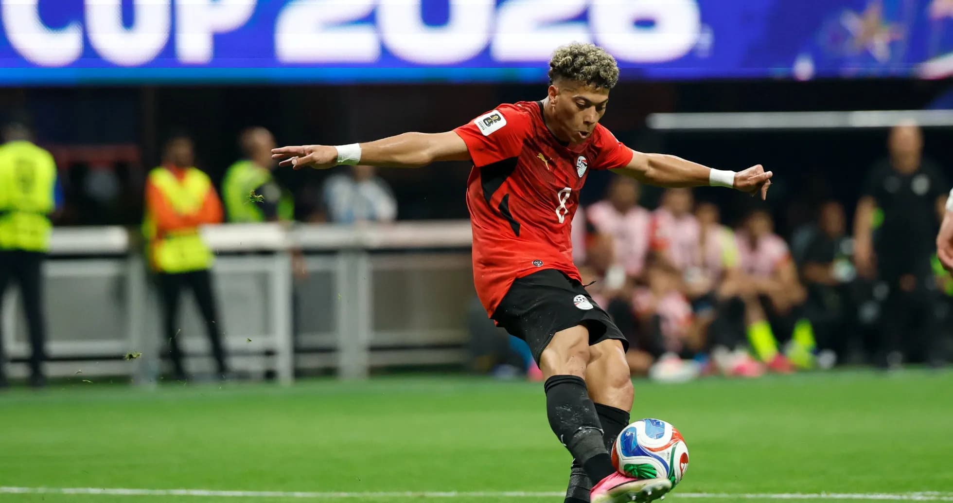 Player kicking the ball during a match