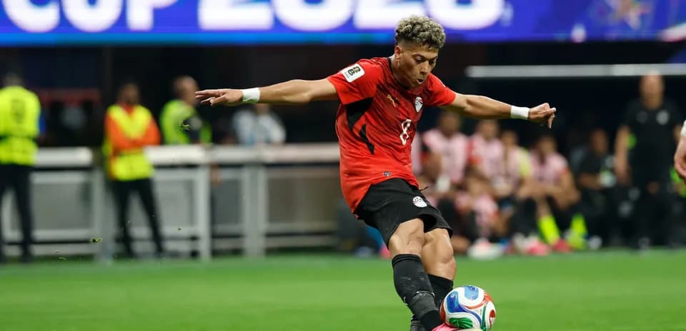 Player kicking the ball during a match