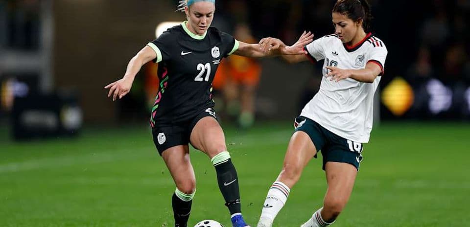 Two players contesting the ball during a soccer match