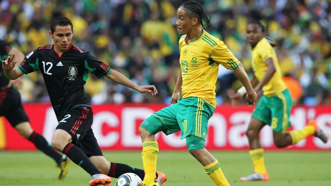 Player dribbling past opponent during soccer match