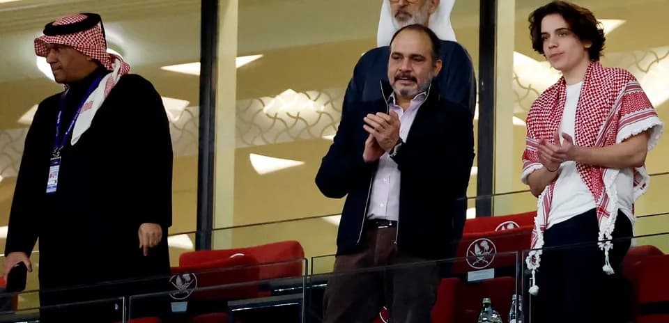 Group of men applauding in a stadium box