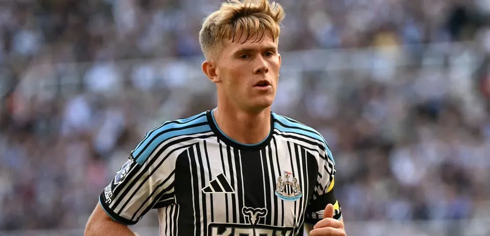 Player wearing Newcastle United jersey during match