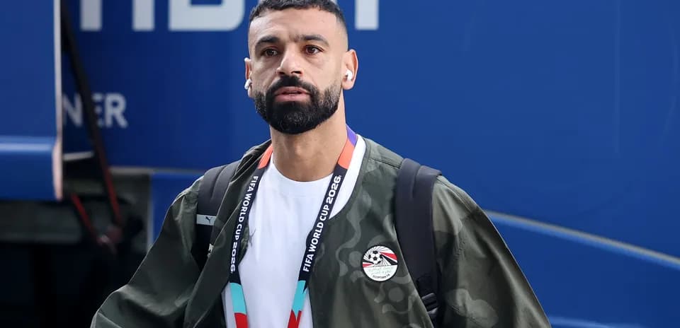 Player arriving at venue wearing team jacket