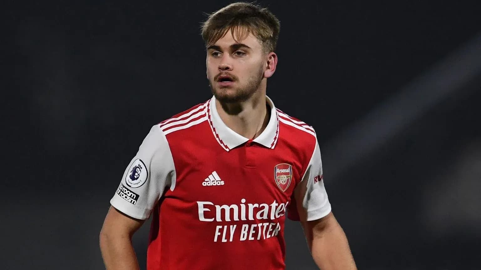 Player in Arsenal jersey during match action