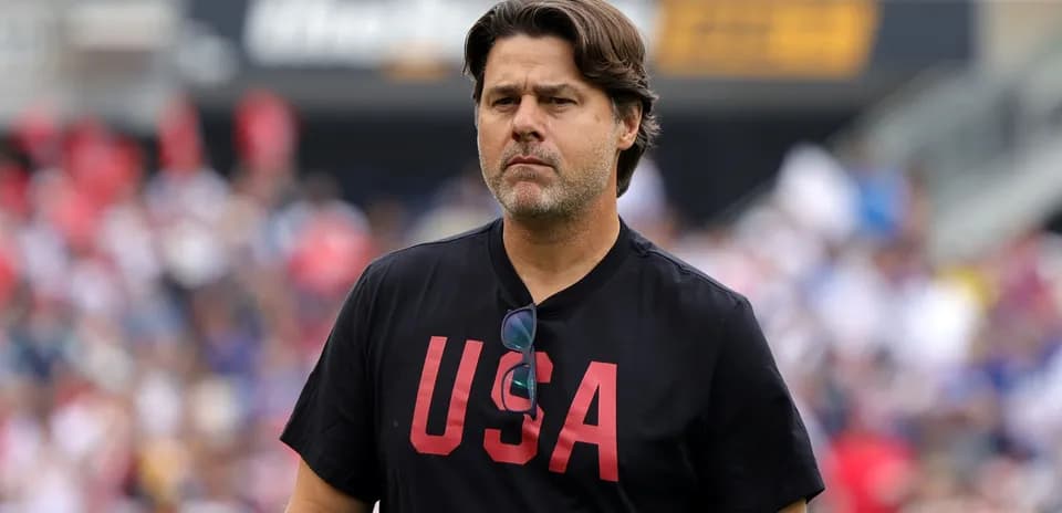 Coach wearing 'USA' shirt on the sidelines