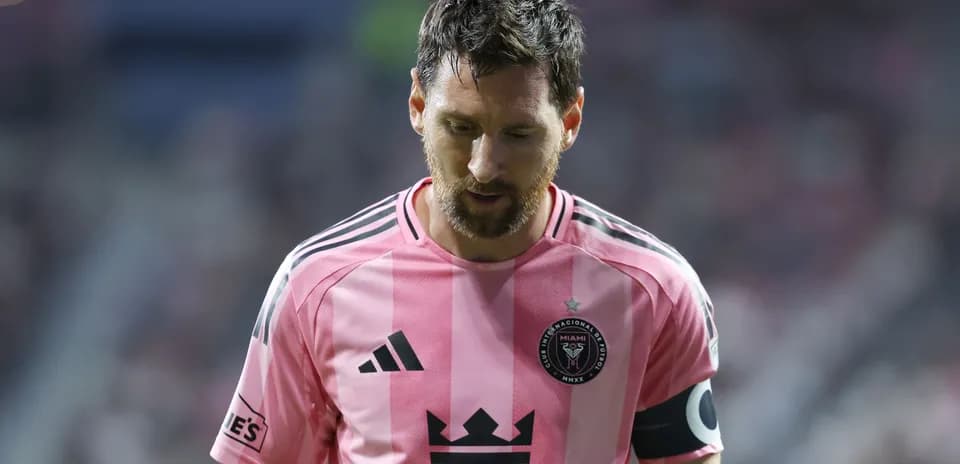 Player in pink jersey walking off the field