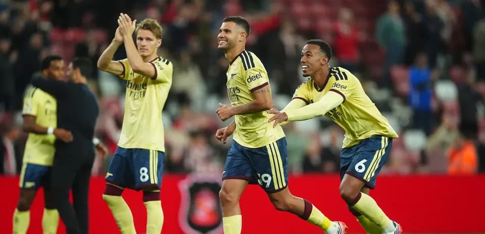 Players celebrating after a goal during match