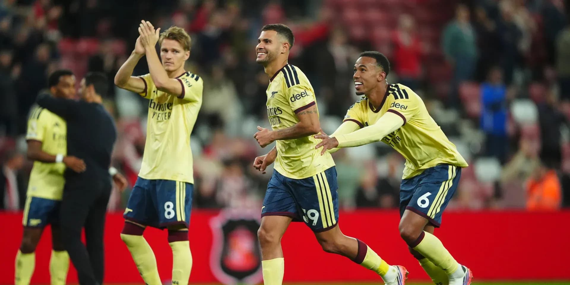 Players celebrating after a goal during match