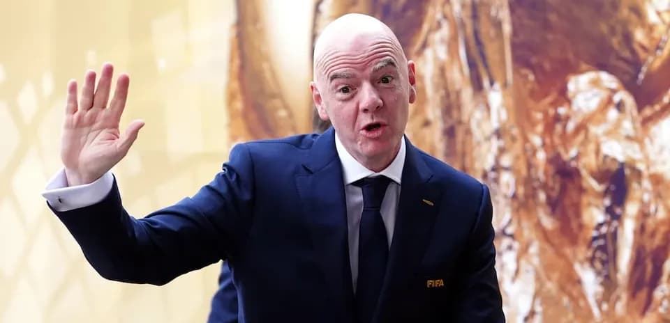 FIFA official gesturing during press event