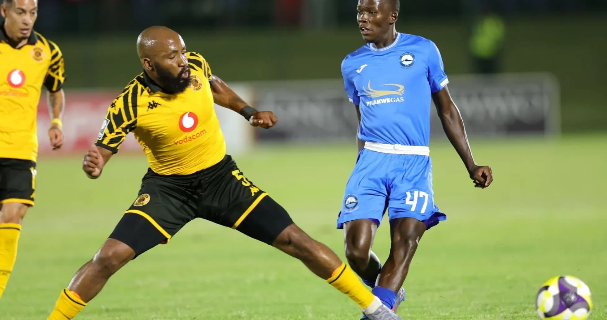 Two players competing for the ball during soccer match