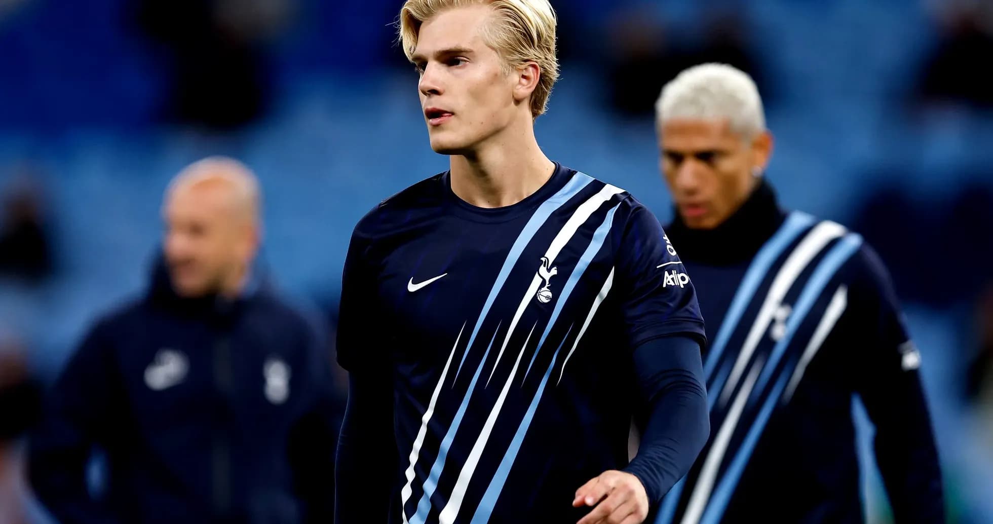 Player walking on pitch in Tottenham training gear
