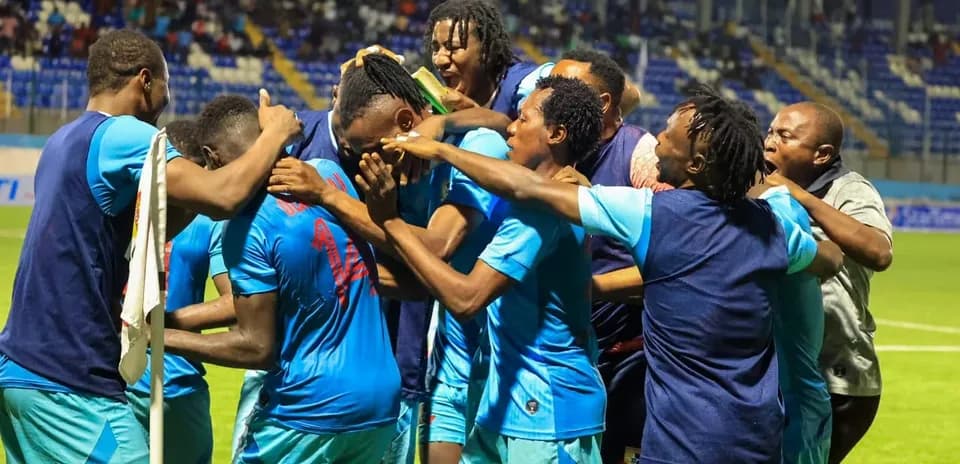 Players celebrating a goal during Rivers United match