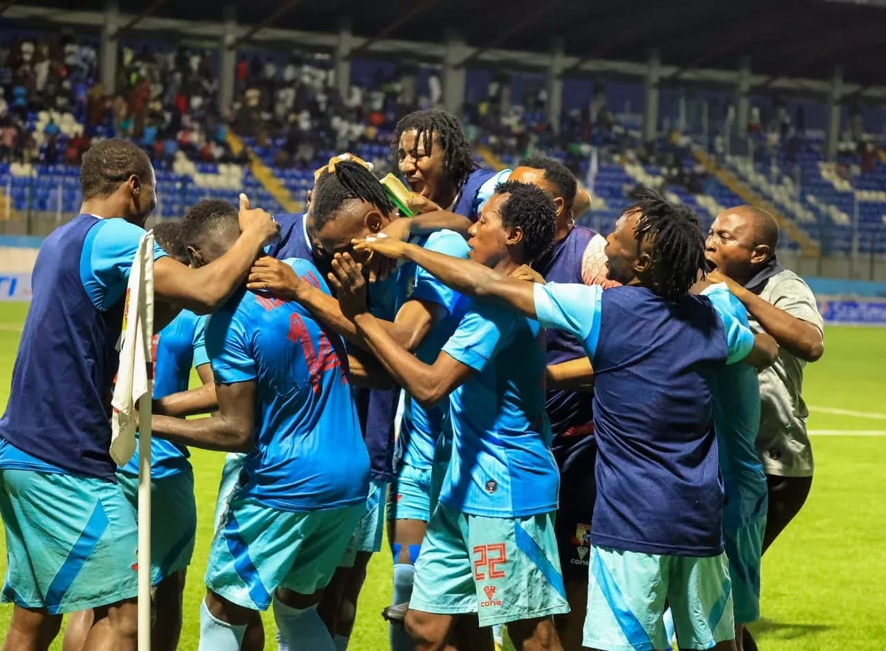 Players celebrating a goal during Rivers United match