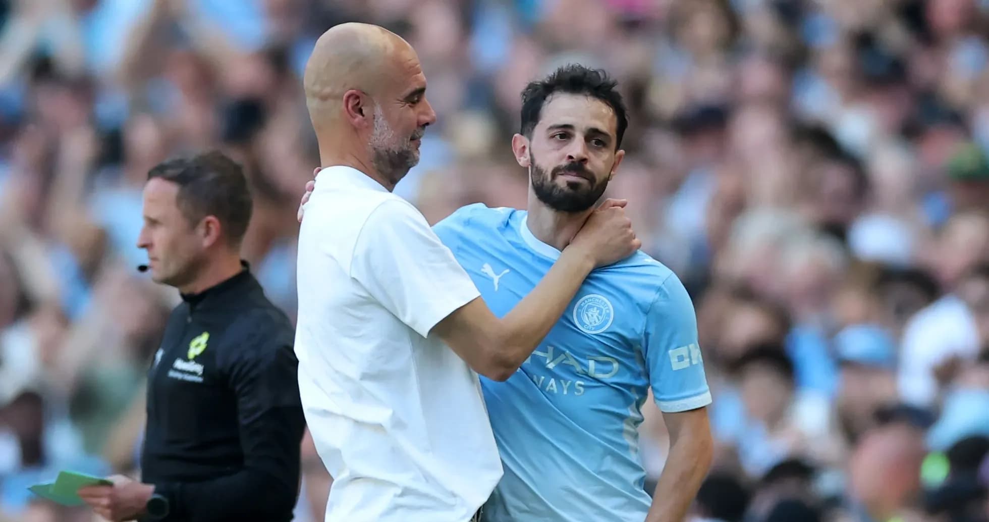 Pep Guardiola embracing Bernardo Silva during match