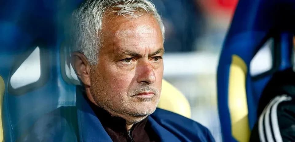 Coach sitting on bench during a match