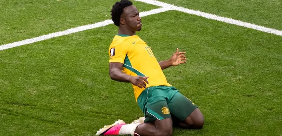 Player celebrating on the field after scoring goal
