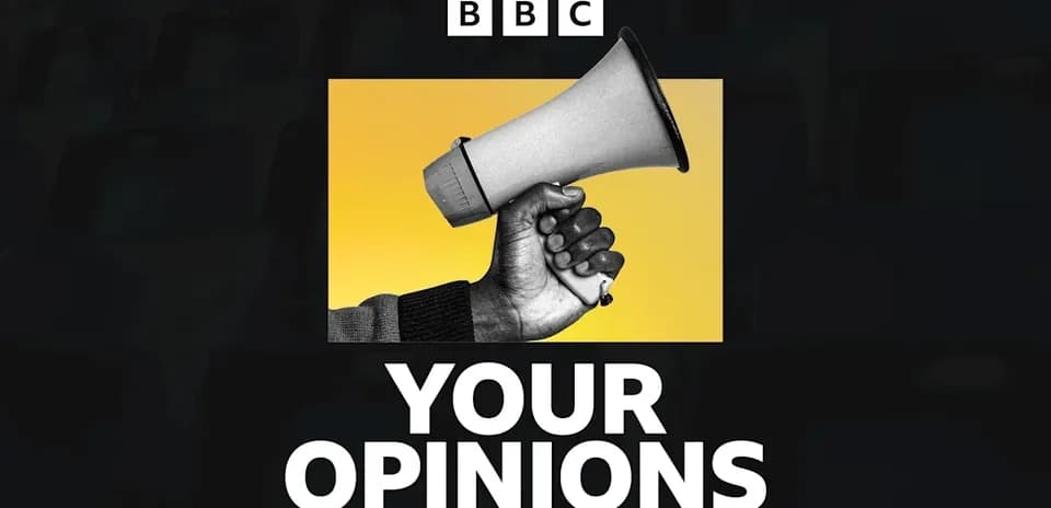 Hand holding a megaphone against a yellow background