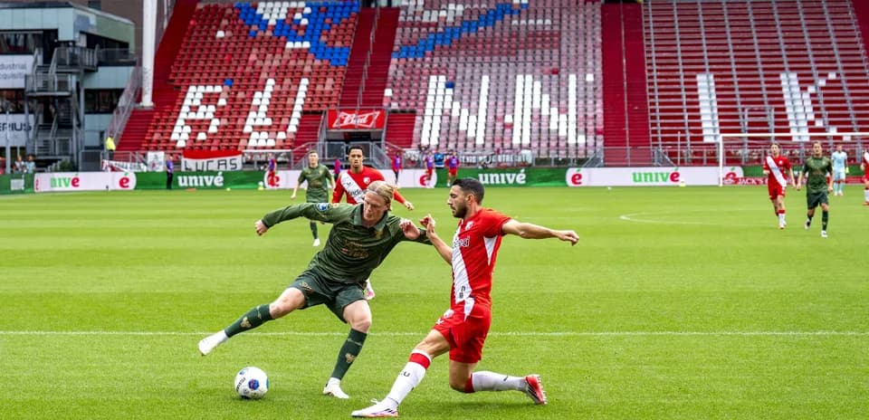 Player tackling opponent during a soccer match