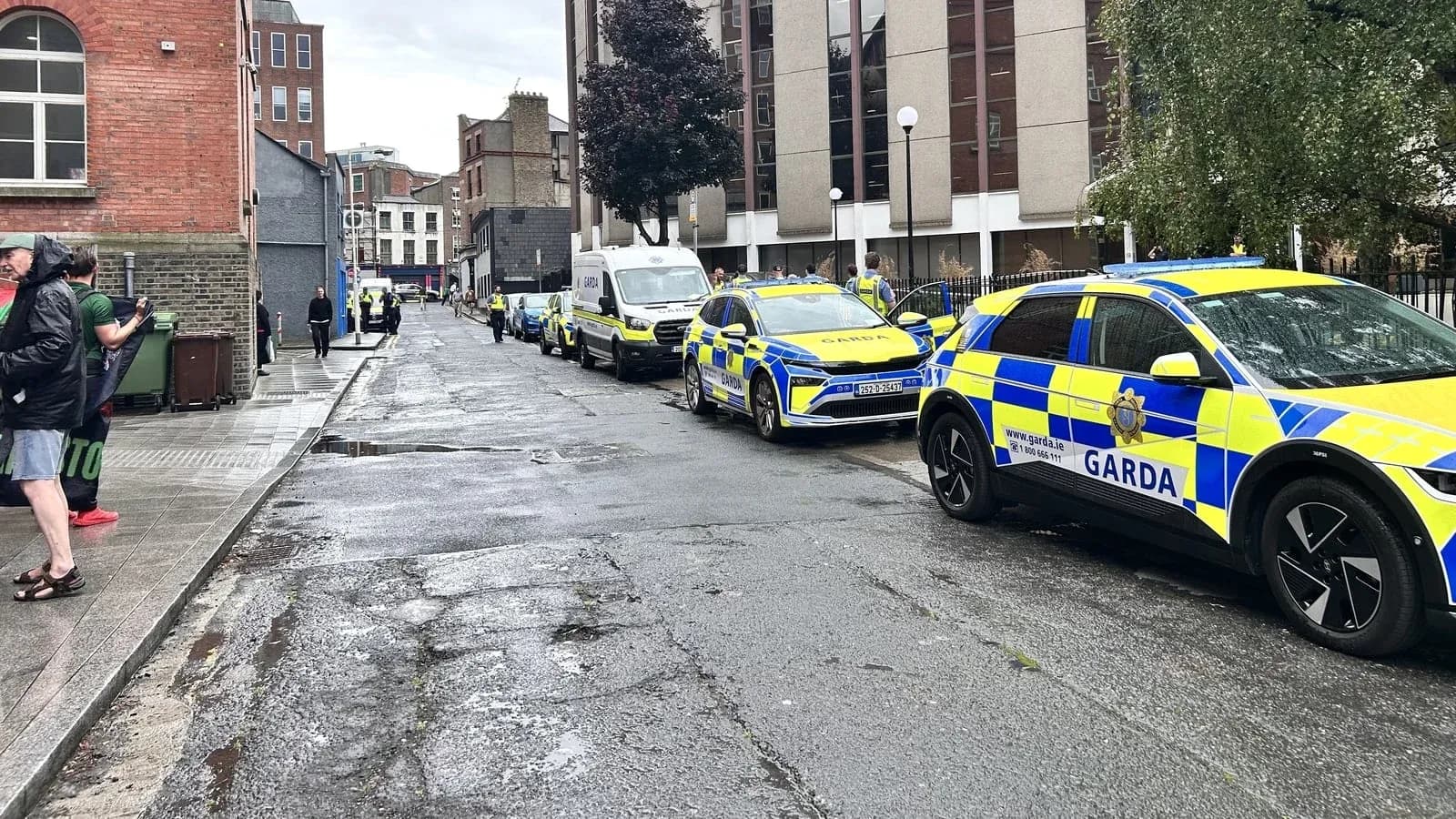 Multiple Garda vehicles parked on a city street