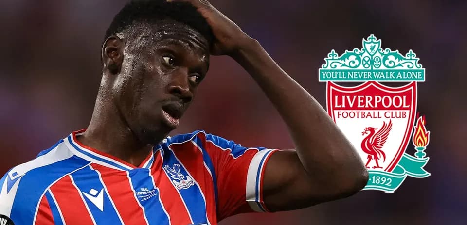 Crystal Palace player with Liverpool logo in background