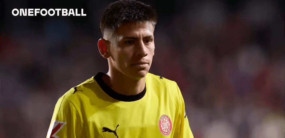 Goalkeeper wearing yellow jersey walking off field