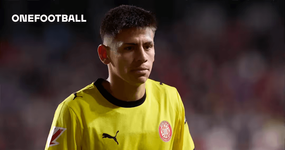 Goalkeeper wearing yellow jersey walking off field