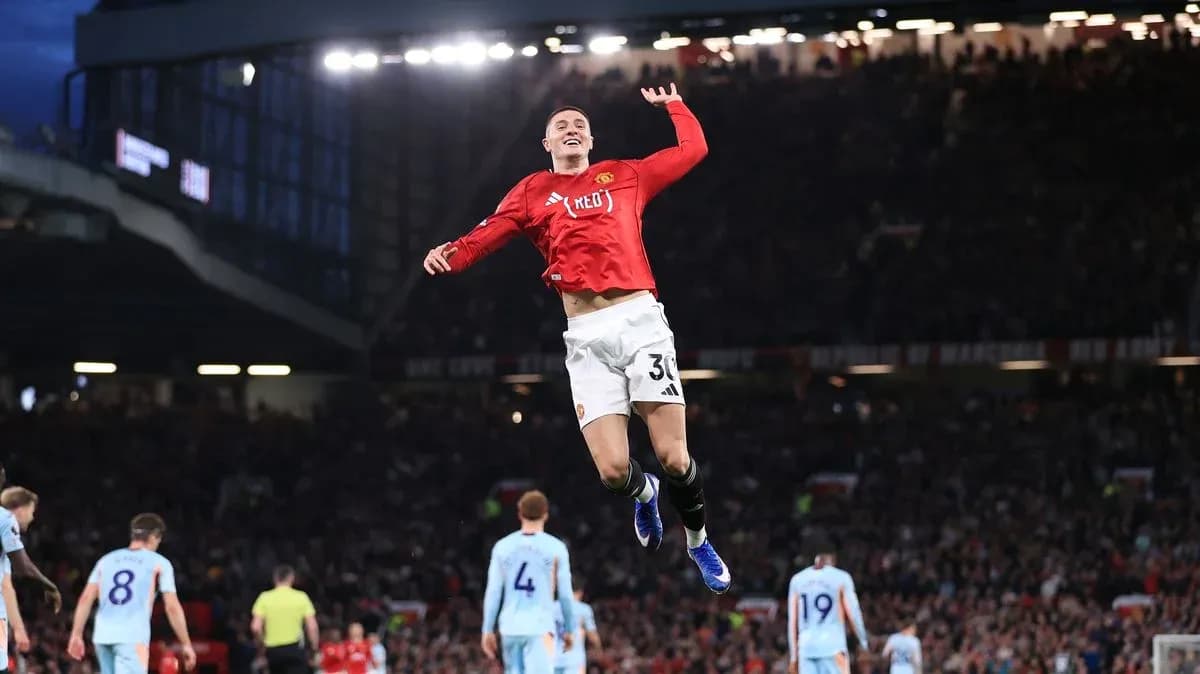 Player celebrating goal during Manchester derby match
