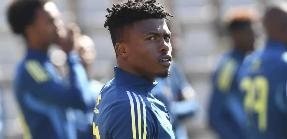 Player focused during training session with teammates