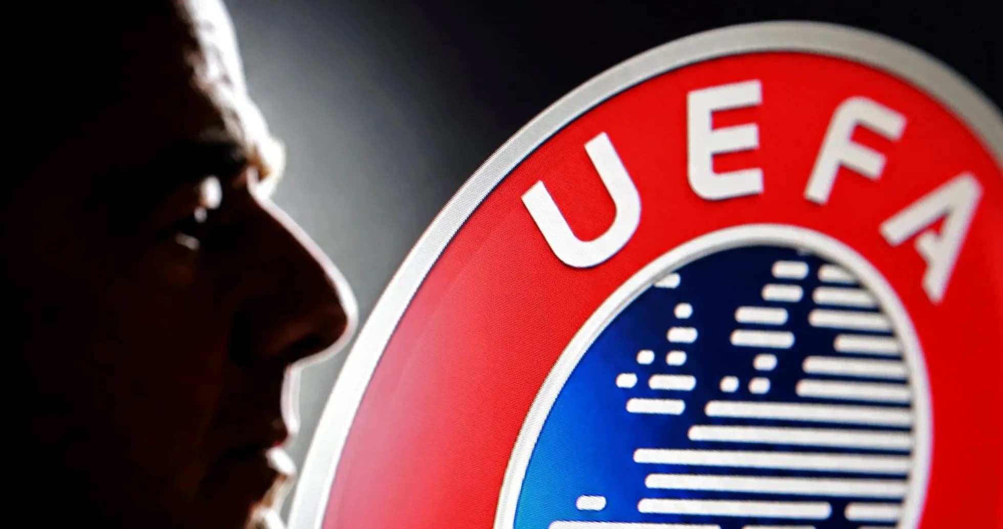 Silhouette of a man beside UEFA logo