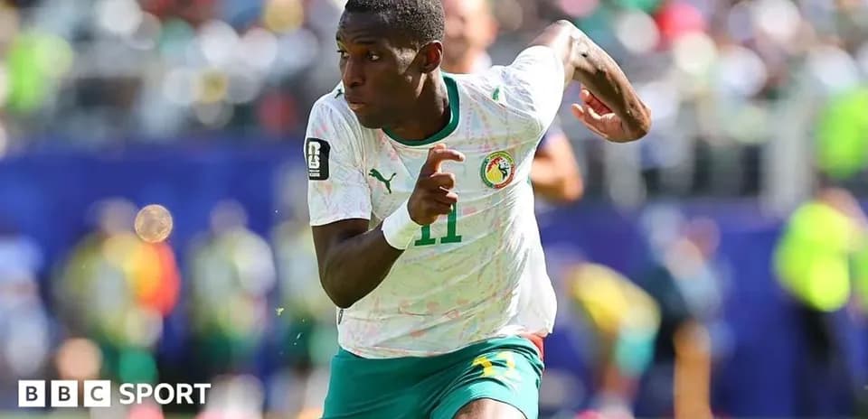 Player sprinting during an African Cup of Nations match
